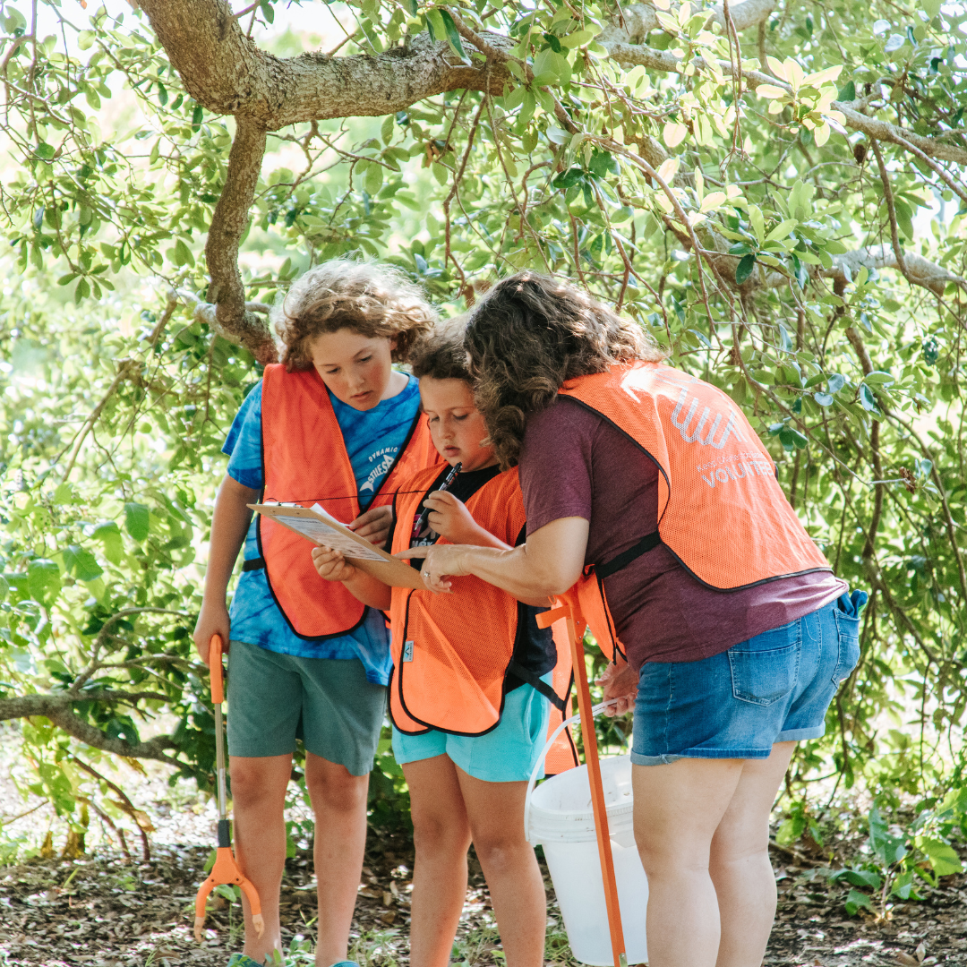 Youth Volunteers with Parent Recording Litter